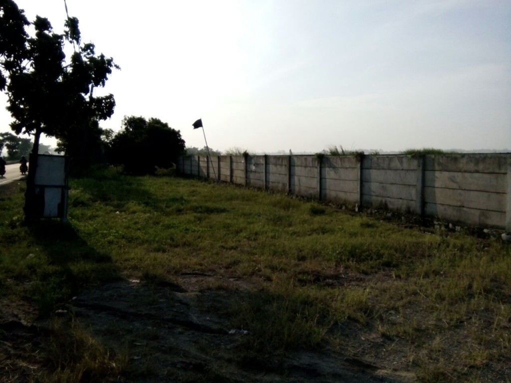 Lahan Tanah Kosong 11,9 Ha di Pinggir Jalan Raya Karawang Barat — foto 1